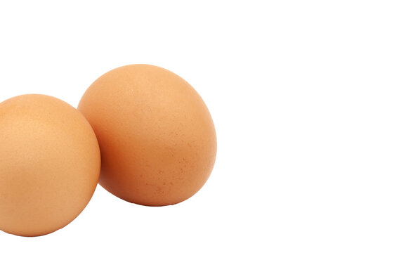 Two brown raw eggs from a chicken on a transparent background. Isolated. Photo in high quality.