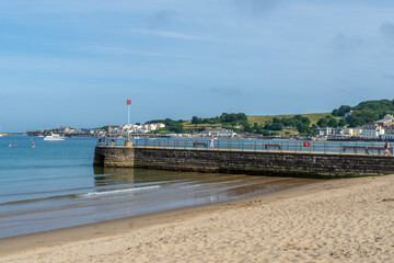Fototapeta premium The sandy Swanage Beach with the Banjo Pier, - Swanage, UK