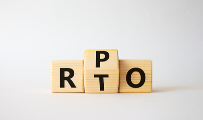 RPO vs RTO symbol. Wooden cubes with words RTO and RPO. Beautiful white background. business concept. Copy space