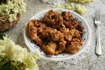 Fried elder flowers on a plate on a table