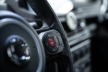 Red special horn button for cyclists on the steering wheel of a modern car. Cyclists and drivers on...