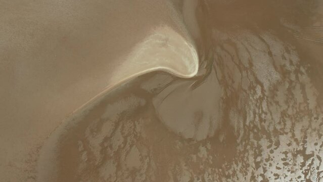 Coastal Pilbara region of Australia tidal mud flats and ocean. Abstract aerial drone patterns and shapes Cossack 4K