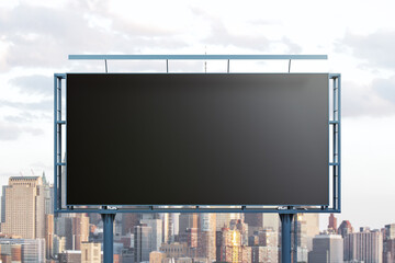 Obraz premium Blank black horizontal billboard on cityscape background, front view. Mockup, advertising concept