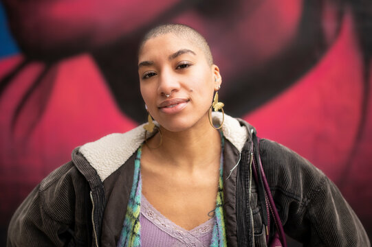 Portrait Of Young Woman At Mural Wall