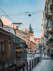 Plakat Prague, Czech Republic - 05 12 2023: Modern tram on the street of the old town in Prague.