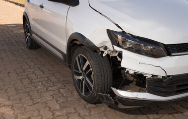 Right front end of a compact car that was damaged in a collision 