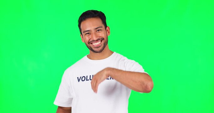 Volunteer, join us and man on green screen for charity, helping and support in community service or nonprofit. T shirt, come and happy face of young asian person with NGO offer on a studio background