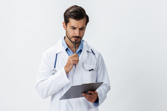 Man Doctor In White Coat With Stethoscope And Record Folder And Patient Chart Unhappy Angry On White Isolated Background, Copy Space, Space For Text, Health