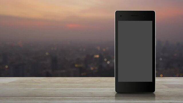 Power button flat icon on modern smart mobile phone screen on wooden table over blur of cityscape on warm light sundown, Start up business online concept
