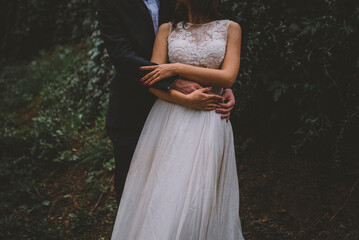 wedding couple holding hands and walking