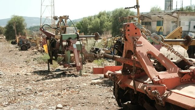Some old rusty machinery, that was put on display in a machinery graveyard on a sunny midday.