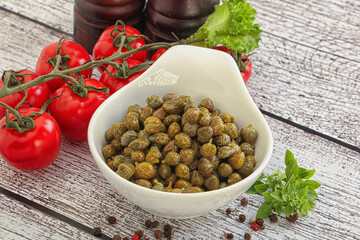 Marinated green capers in the bowl