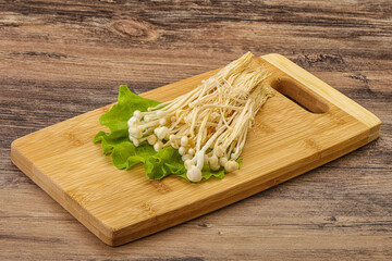 Raw Enoki mushrooms for cooking