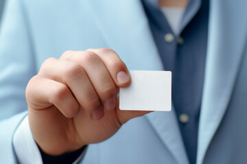 a person man in a blue suit holds a blank business card mockup
