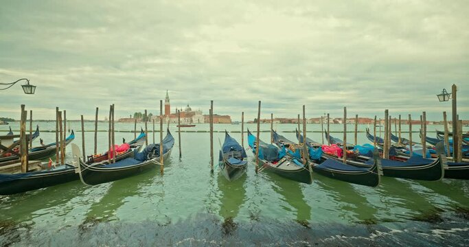 Gondolas by Saint Mark square with San Giorgio di Maggiore church in the background in Venice Italy