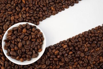 Top View of Robusta Coffee Beans in a White Ceramic Bowl. Space for Text.