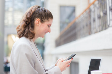 Fototapeta premium Businesswoman using a mobile phone
