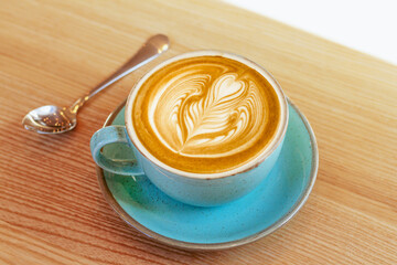 Cup of cappuccino latte with art frothy foam