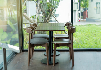 Modern cafe in loft style, black table set for coffee.
