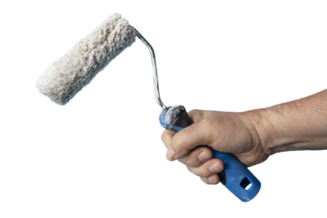 a roller brush in hand
