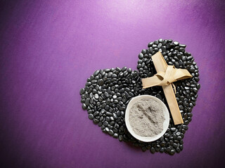 Lent Season,Holy Week and Good Friday concepts - image of cross and bowl of ashes on heart shape in...
