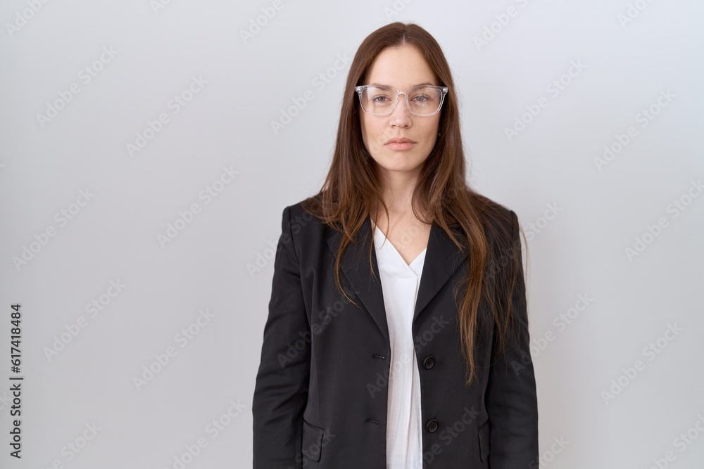 Sticker beautiful brunette woman wearing business jacket and glasses relaxed with serious expression on face