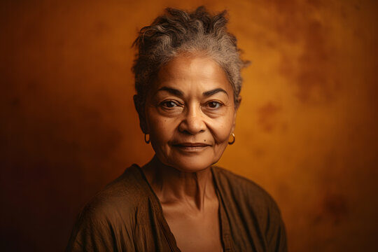 Generative AI Illustration Portrait Of Senior Female In Orange Casual Clothes With Curly Gray Hair Looking At Camera Against Orange Studio Background