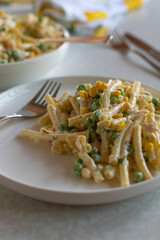 Plate with classic pasta salad on a table