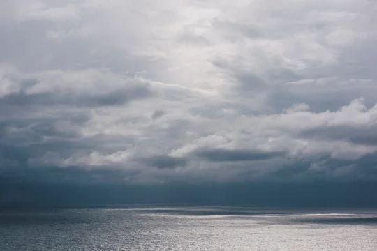 Storm clouds over the Pacific ocean at dusk