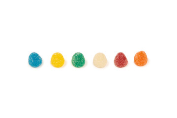 Assorted colorful gummy candies isolated on a white background.