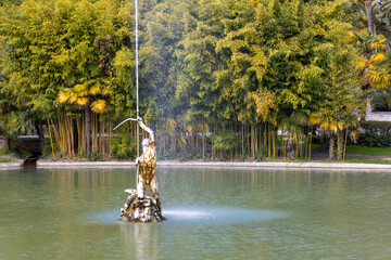 Fountain Sagittarius against tropical foliage in the Primorski Park or Prince of Oldenburg park in...
