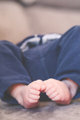 Feet of a baby lying in bed