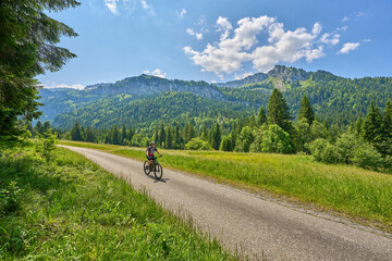 nice senior woman with electric mountain bike in the Bregenz Forest mountains, Vorarlberg, Austria