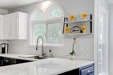Minimal Modern Kitchen Interior Sink Detail with Arched WIndows and Styled Shelves