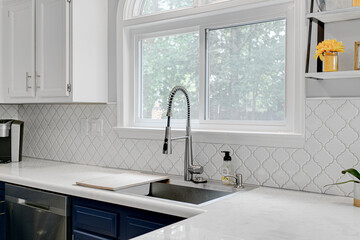 Minimal Modern Kitchen Interior Sink Detail with Extendable Faucet and Styled Shelves