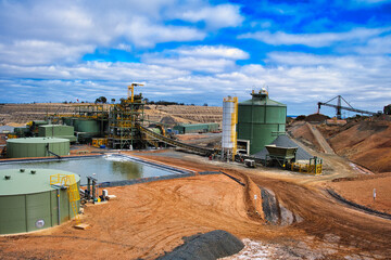 The Central Norseman gold mine in Norseman, Western Australia, with CIL tanks, tailings thickener pad, industrial buildings and heavy machinery.
