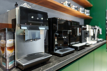 Row of many coffee machines on sale in store