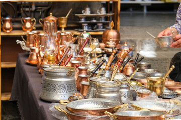 Pots, teapots and souvenirs are made from copper. Copper kitchenware in Gaziantep Bakırcılar Bazaar.