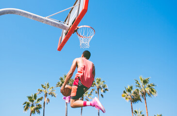 Basketball slam dunk on a californian court