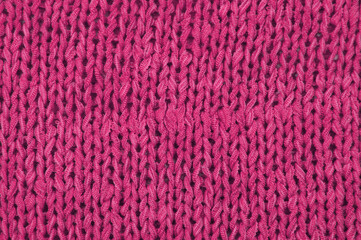 pink unusual texture.knitted purple sweater close up. handmade concept	