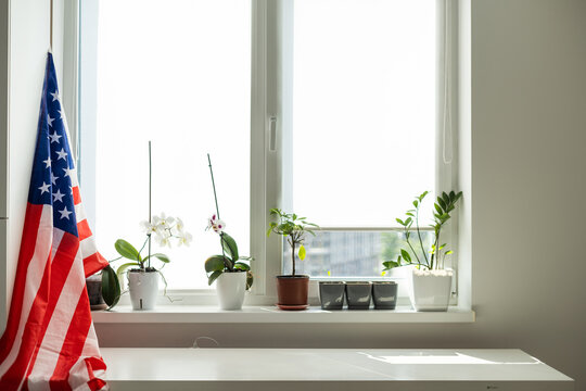 Interior of stylish room with modern workplace and USA flag
