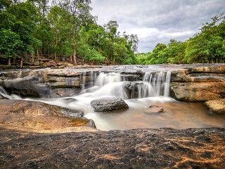 Fototapeta na wymiar Tat ton Waterfall located in Chaiyaphum Province, Tat ton National Park, Thailand