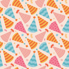 Fototapeta premium Cute seamless pattern with birthday party hats in groovy style. Childish design with holiday caps for wrapping paper, prints, background, fabric, scrapbook. Bright holiday digital paper for kids