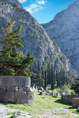 view to the ruins and the sacred way leading to the treasury of the Athenians in Archaeological Site of Delphi, Greece 