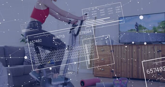 Animation of data processing over caucasian woman cycling on stationary bike at home