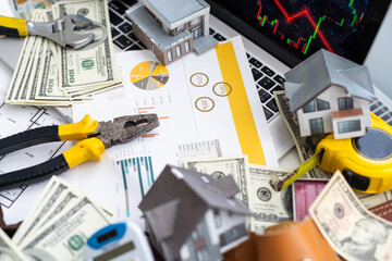 Working on construction project background. Office table with dollars and pen