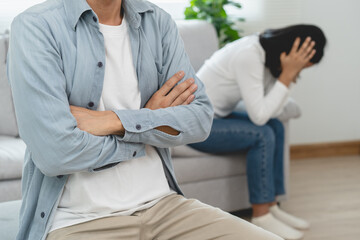 Family divorce problem concept, Husband and wife sitting separating after arguing in the living...