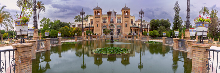 Facade of an old building with Arabic ornaments at sunset. Seville. Spain. Andalusia.