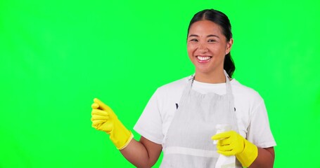 Happy asian woman, housekeeper and pointing on green screen with detergent for clean hygiene. Portrait of female person, maid or cleaner for advertising with spray bottle against a studio background