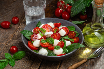 Caprese salad with tomato, mozzarella and basil